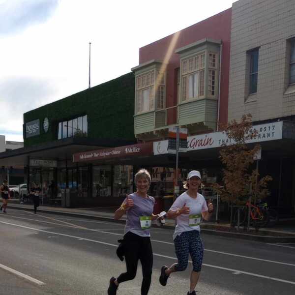 Louise and Liz, sisters running the 5km event at the Ballarat Marathon event smiling at the camera with thumbs up