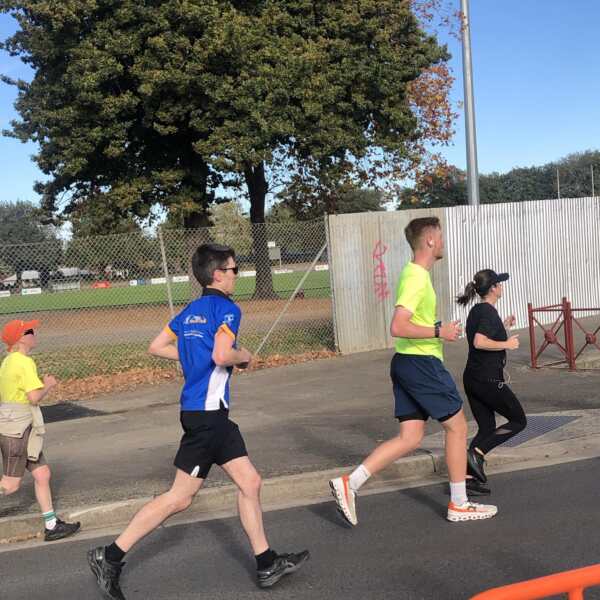 Tom running in a blur short with sunglasses in the half marathon at the Ballarat Marathon event